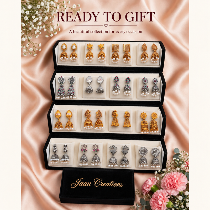 Black velvet box with 16 pairs of temple jhumka earrings on pink silk with flowers, ready to gift – Jaan Creations