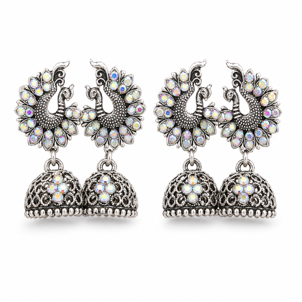 Oxidised silver double peacock jhumka earrings with rainbow crystals on white background
