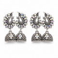 Oxidised silver double peacock jhumka earrings with rainbow crystals on white background