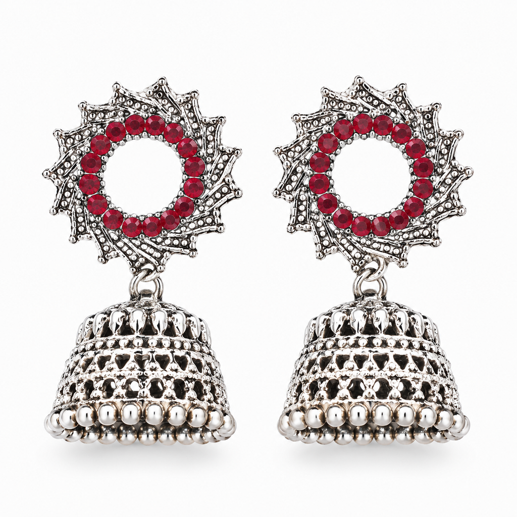 Oxidised silver red stone sunburst jhumka earrings on white background