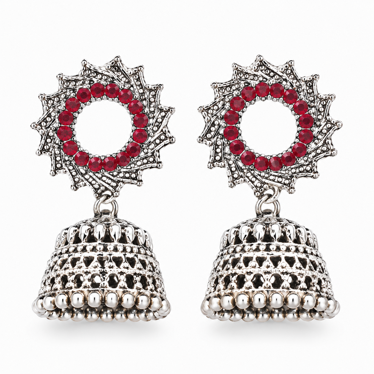Oxidised silver red stone sunburst jhumka earrings on white background
