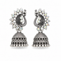 Oxidised silver peacock jhumka earrings with rainbow crystals on white background