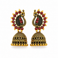 Antique gold peacock jhumka earrings with red stones on white background