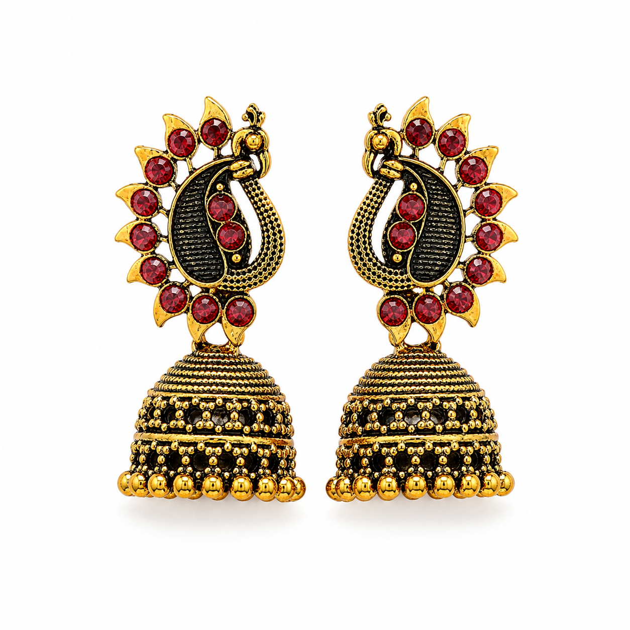 Antique gold peacock jhumka earrings with red stones on white background
