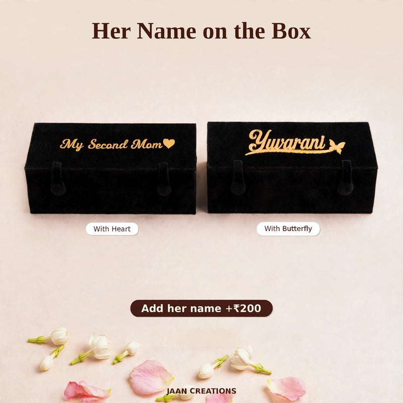 Two black velvet jhumka gift boxes with gold mirror name plates – "My Second Mom" with a heart and "Yuvarani" with a butterfly. Add her name or a message on the box for ₹200 – Jaan Creations