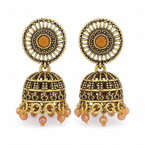 A pair of ornate Indian jhumka earrings in antique gold-tone metal with amber-colored circular stones and dangling peach-pink beads, shown on a plain white background.