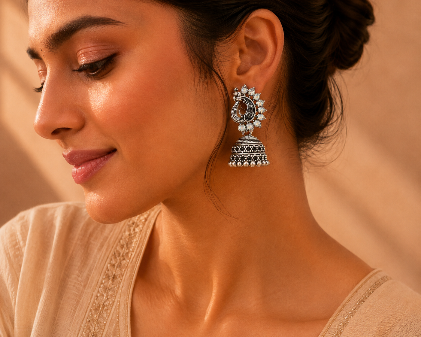 Silver oxidised peacock jhumka earrings styled as ethnic wedding jewelry