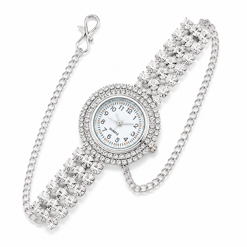 A silver-tone quartz watch with a round white dial, surrounded by a halo of clear crystals, and a wide crystal-embellished link bracelet with an attached curb chain clasp, shown on a white background.