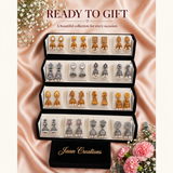 Black velvet box with 16 pairs of temple jhumka earrings on pink silk with flowers, ready to gift – Jaan Creations